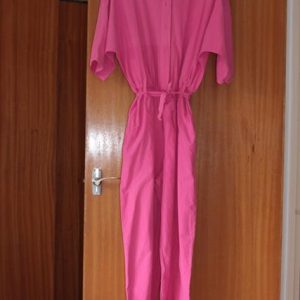 Pink jumpsuit, button detail on sleeves