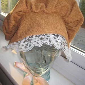 Tan bonnet with cream ribbon edging