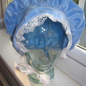 Blue bonnet with white ribbon edging