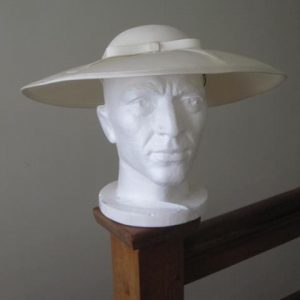 Beige wide brimmed hat with ribbon detail