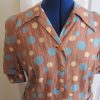 Beige spot dress with buckle belt, short sleeved