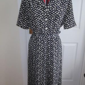 Navy patterned dress, short sleeved, buckle belt, pleated skirt